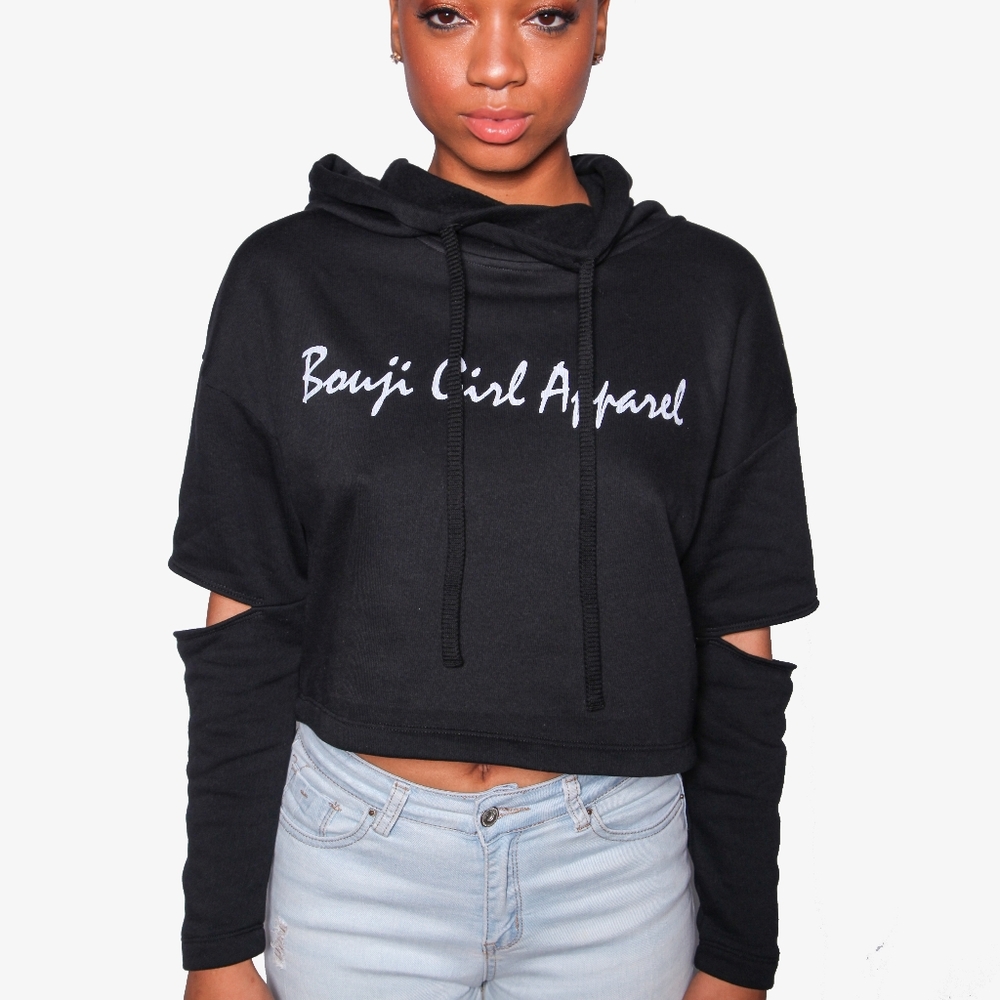 Cropped hoodie with exposed elbows.